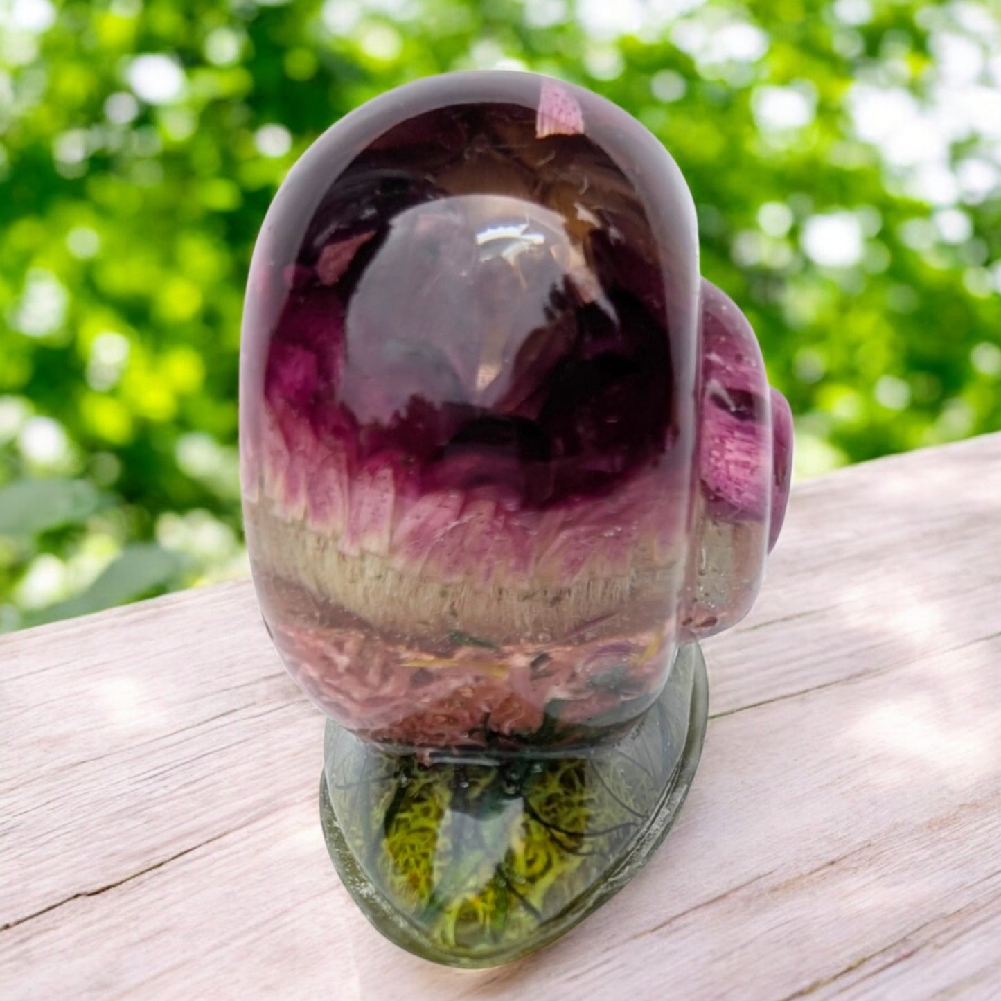 Small resin snail keepsake held in hand to show size – handmade woodland art gift for plant lovers
