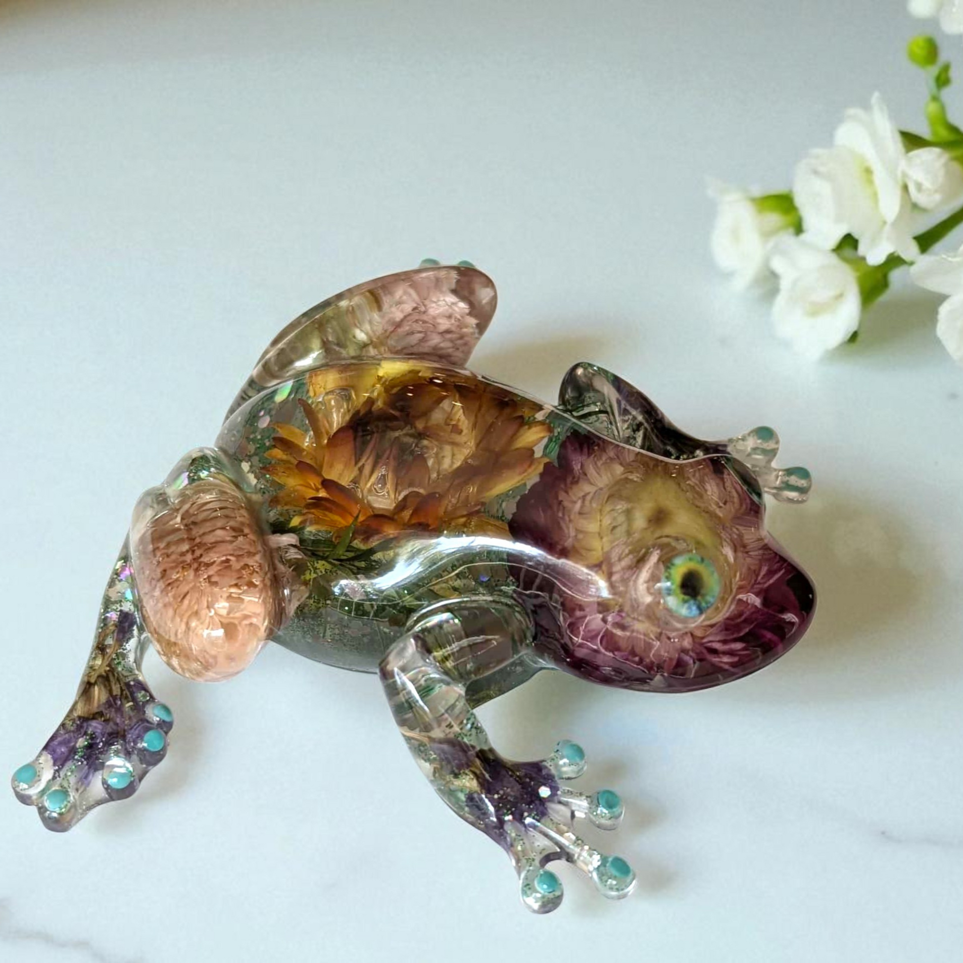 Right side view of resin frog figurine showing real pressed flowers – decorative frog decor for nature lovers