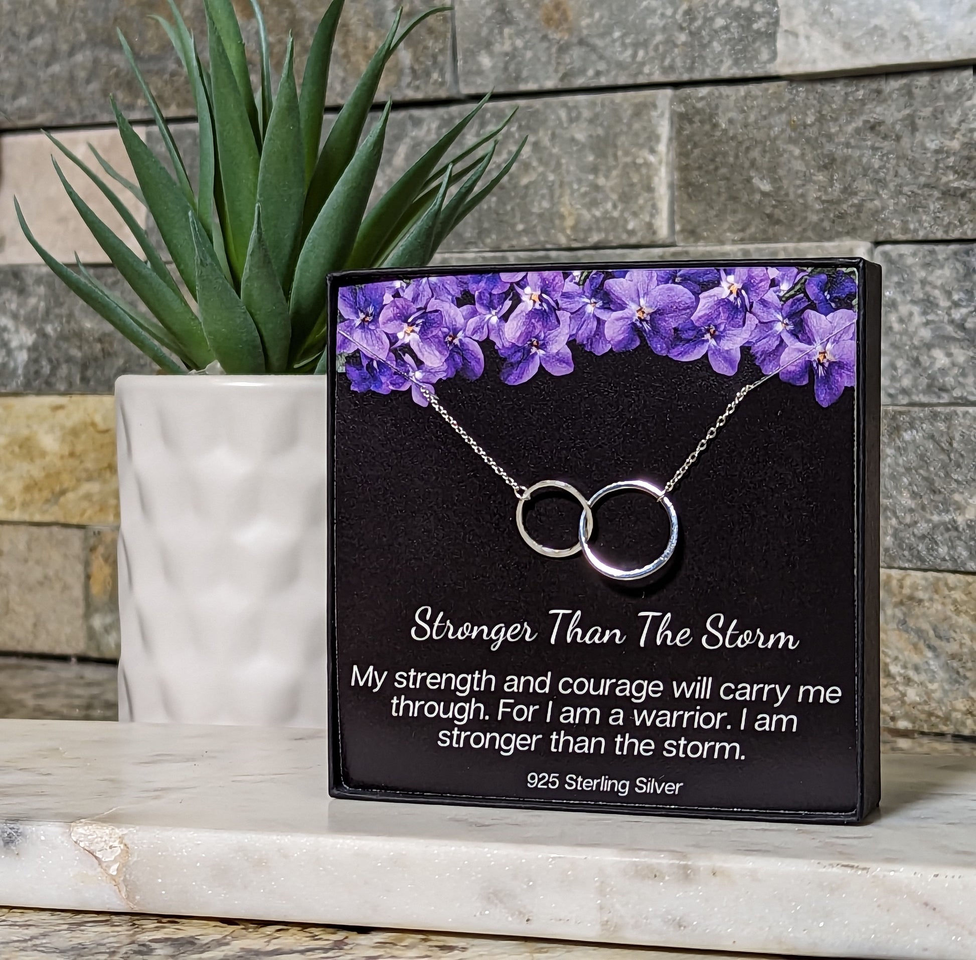 Elegant sterling silver infinity necklace displayed in a black jewelry box -inspirational jewelry gift for women