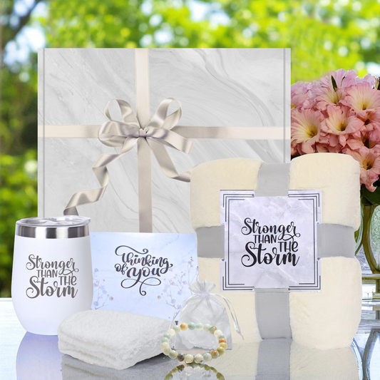 Women's 'stronger than the storm' self-care gift box with cozy beige blanket, ivory socks, Amazonite stone bracelet, white 12 oz  tumbler and thinking of you card – perfect get well gift for her. 